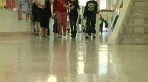 Grammar school students walking down the hall Stock Footage 8979349