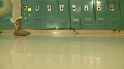 Grammar school students walking by hallway lockers (1 of 2) Stock-Footage 8979355