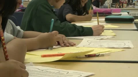 Grammar school students working on papers in classroom (10 of 11) Stock Footage 8978843