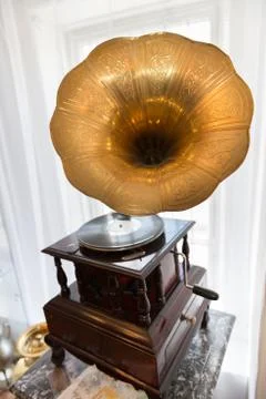 Gramophone in front of a window Stock Photos