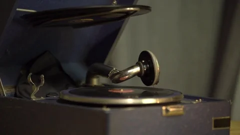 Gramophone with a vinyl record in a retro interior. Phonograph plays old music Stock-Footage 81367956