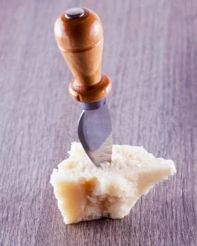 Grana cheese over table Stock Photos