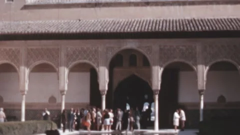 Granada, Spain - 1970: People queue in Alhambra Palace and Fortress complex Stock Footage 169689922
