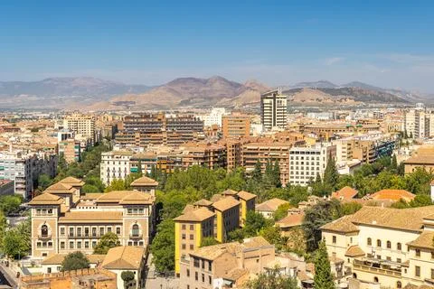 Granada town in Spain. Elevated view of a city nestled in a valley, surroun.. Stock Photos