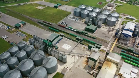 Granary on green field. Elevator on outdoor plant. Stock Footage 134592500