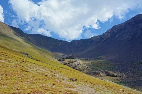Grand alpine mountain range during summer on a hiking trail leading from Juta Stock Photos