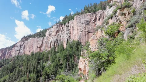 Grand Canyon, looking up from hiking path with hiker to cliff. USA. Stock Footage 281558060