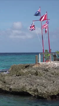Grand Cayman Caribbean Ocean rocky shore restaurant vertical Stock Footage 58564209