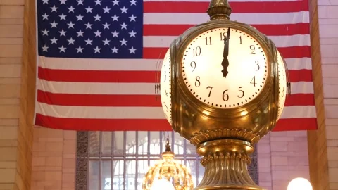 Grand Central Terminal clock, 42 street New York USA. Flag inside railway Stock Footage 326274638
