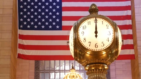 Grand Central Terminal clock, 42 street New York USA. Flag inside railway Stock Footage 346602286
