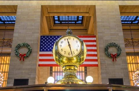 Grand Central’s Main Concourse Clock. Famous Golden Structure. USA Flag. Stock Photos