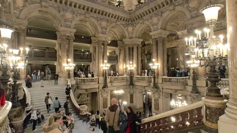 Grand Escalier inside the Palais Garnier and tourists Stock Footage 329090845