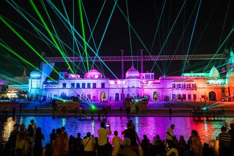 Grand Evening Laser Display at Ayodhya Riverfront With Spectators Gathering Stock Photos