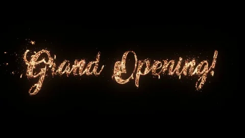 Grand Opening greeting text with particles and sparks isolated on black backgrou Stock Footage 85386342
