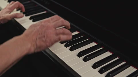 Grand piano playing in studio setting elderly individual skillfully Vidéo 329095586