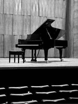 Grand piano set on stage, B&W Stock Photos