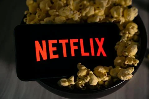 Grand Prairie TX/USA Aug 2019: Netflix in a bowl of popcorn with spooky shadows. Stock Photos
