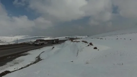 A grand range of snow capped mountains stretches across, stock footage. Stock Footage 304867087