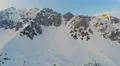 Grand rocky mountain range covered with snow, avalanche danger, risky expedition 4k or 4k+ Resolution