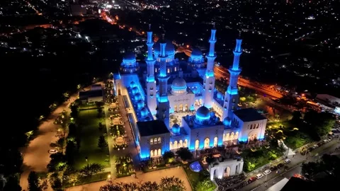 Grand Sheikh Zayed Mosque in Solo City illuminated at night. Aerial of Java Stock Footage 303810318