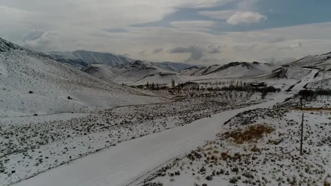 A grand snow capped mountain with two rugged peaks rises, stock footage. Stock Footage 304866484