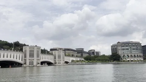 Grand stone bridge spans wide river under cloudy sky Stock Footage 340034435