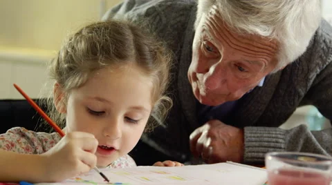 Grandfather and granddaughter painting Stock Footage