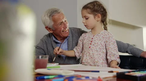 Grandfather and granddaughter painting Stock Footage