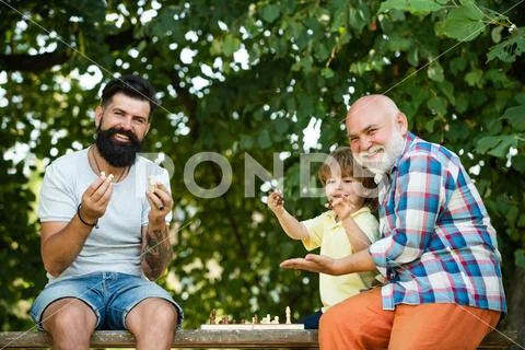 Grandfather portrait on blue sky backgrounds. Happy kids time. Happy three Stock Photos