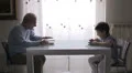 grandfather reads a book while baby reads a ebook with his tablet HD Footage