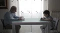 grandfather reads a book while baby reads a ebook with his tablet HD Footage