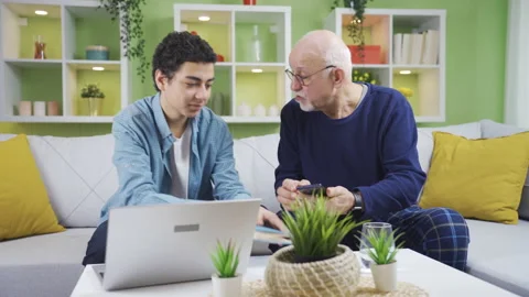 The grandfather, who encounters a problem while using the phone Stock-Footage 233129567