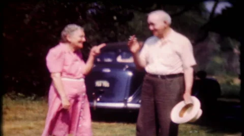 Grandma and grandpa ham it up for camera 1950s vintage film home movie 1766 Stock Footage