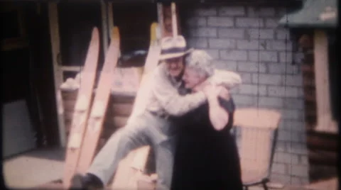 Grandma and grandpa play around for camera 1950s vintage film home movie 2772 Stock Footage