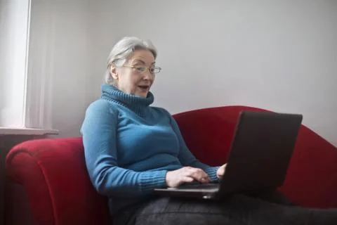 Grandma on the couch Stock Photos