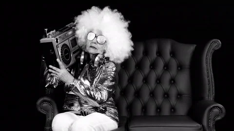 Grandma dj cool woman retired elderly music party ghettoblaster Stock Footage