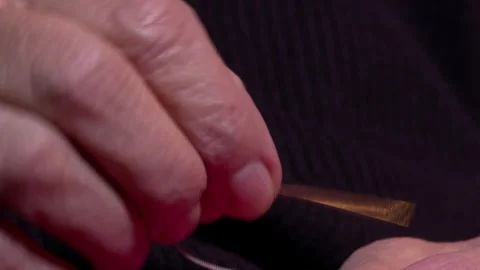 Grandma is sewing a button 3 Video stock 325601411