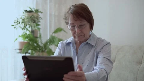 Grandma with a tablet. Stock Footage 167590985