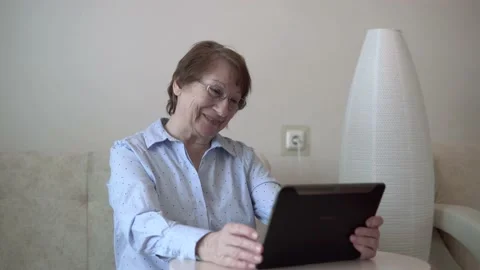 Grandma with a tablet. Stock Footage 167591011