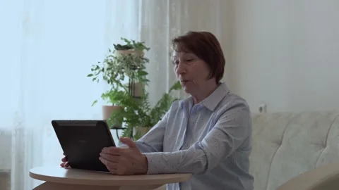 Grandma with a tablet. Stock Footage 167591012