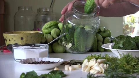Grandma's Marinated Cucumbers on the kitchen table Stock Footage 239658935