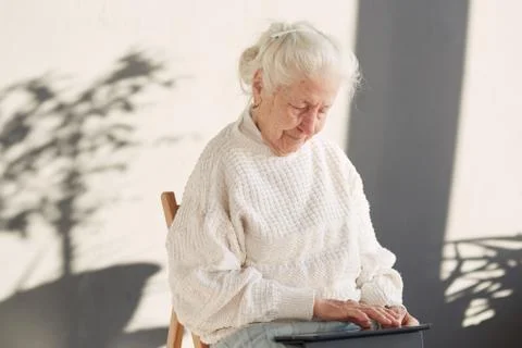 Grandmother and modern technology Stock Photos