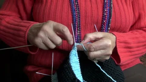 Grandmother hands knitting new sweater Stock Footage