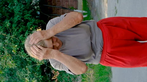 Grandmother has a headache on the road. Selective focus. Stock Footage 214867167