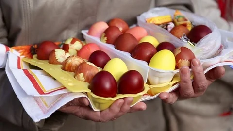 Grandmother holds the easter eggs Stock Footage 74787034