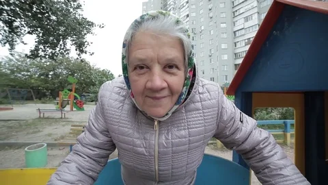 Grandmother on the playground. Stock Footage
