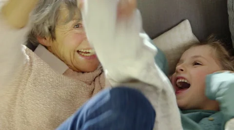 Grandmother playing with granddaughter Stock Footage