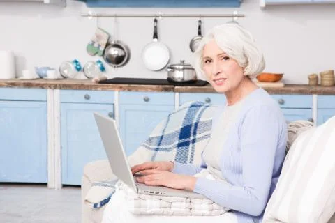 Grandmother using laptop computer Stock Photos