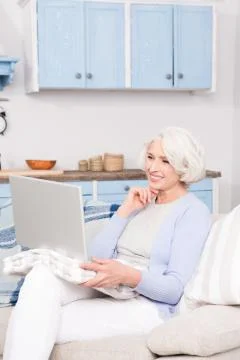 Grandmother using laptop computer Stock Photos