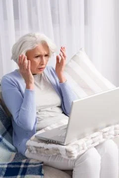 Grandmother using laptop computer Stock Photos